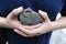 Closeup of male hands holding Aztec power stone