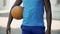 Closeup of male hands holding ball, preparing for game, active lifestyle