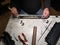 Closeup of the male technician\'s hands repairing the printer