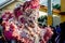 Closeup man in brilliant masquerade costume pass on city street at dominican carnival