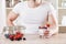 Closeup on man with delicious yoghurt with fresh berries