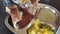 Closeup of a man eating masala dosa with mashed potatoes and coconut chutney