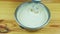 closeup at man by electric mixer start mixing white liquid dough in metal saucepan