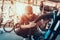 Closeup of Man Examines Bicycle Wheel in Workshop