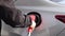 Closeup of man filling benzine gasoline fuel in car at gas station