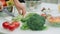 Closeup man hands chopping cucumbers for fresh salad. Chef male making salad