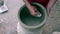 Closeup Man Hands Polish Clay Pot with Sea Mussel Shell