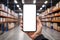 Closeup of man hands using mobile phone in warehouse, white screen, mockup, with industry background