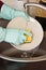 Closeup of man hands wahing dishes in the kitchen