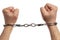 Closeup of man holding handcuffed fists