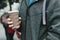 Closeup on man holding paper cup