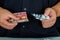 Closeup of a man with a pile of euro bills and pills in his hands