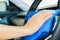 Closeup for man polishing cleaning car steering wheel with microfiber cloth