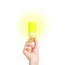 Closeup of man\'s hand holding energy saving lamp. Glows brightly