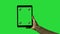 Closeup of man\'s hand sliding on tablet green screen