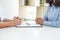 Closeup of a man Signing Contract or premarital agreement, filling petition form agreement of divorce in office at lawyer desk in