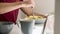 Closeup of a man swirling spaghetti with pesto sauce with a fork