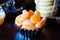 Closeup mandarin slices in baking dish, cookies and chocolate in the background, Christmas time