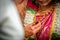 Closeup of Mangal Sutra or Thaali of an Indian Hindu Bride wearing garland and golden jewelry