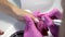 Closeup of manicurist removes gel shellac polish from client`s nails using manicure machine
