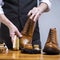 Closeup of Mans Hands Cleaning Luxury Calf Leather Brogues with Special Accessories And Tools