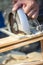 Closeup of manual worker using circular saw