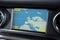 Closeup of a map on a navigator in a modern car under the lights