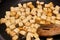 Closeup of marinated cubes of tofu being sauteed to golden color in a stick free pan