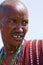 Closeup of a Masai warrior looking in the savanna