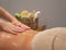 Closeup of massage spa procedure on blur background with copy space. Salon relax therapy with female hands and body