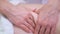 Closeup of masseur hands doing anti cellulite massage on abdomen of young woman