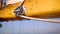 Closeup of the mast of a wooden antique Sail boat navigating in the ocean sunny day showing the wooden parts and