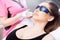 Closeup master carries out removal of unwanted hair laser on face woman