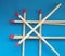 Closeup of matchsticks over blue background.