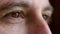 Closeup of mature man thinking about the past and future while daydreaming about ideas. Face and eyes of a lonely and