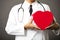 Closeup of medical doctor hands with heart