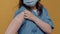 Closeup of medical doctor wearing surgical mask lifting sleeve and showing band aid after covid or flu vaccine