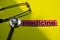 Closeup medicine with stethoscope concept inspiration on yellow background