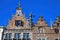 Closeup of medieval gabled house facades with church tower against blue summer sky - Nijmegen, Netherlands