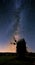 Closeup medieval windmill silhouette on a night sky background