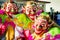 Closeup men in pied scary clowns costumes pose for photo at dominican carnival