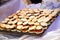 Closeup of a mini burger platter on a tablecloth under the lights