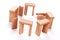 Closeup of a mini wooden domino Stonehenge on a white surface