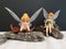 Closeup with miniature Disney fairies Tinkerbell.