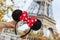 Closeup on Minnie Mouse Ears in hand in front of Eiffel tower