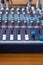 Closeup mixer in recording room. Closeup button to increase or decrease sound