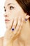 Closeup of a Model Wearing a Tanzanite Designer Ring and Earring