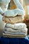 Closeup on modern housewife prepare sweaters pile for storage