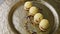 Closeup modernly decorated four spherical sponge biscuits spinning on plate