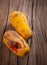 Closeup of moldy papaya fruit on wood